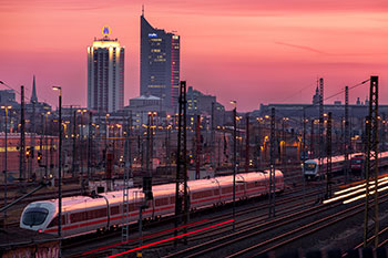 Leipzig city skyline at sunset with trains in view