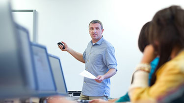 lecturer teaching in computer lab