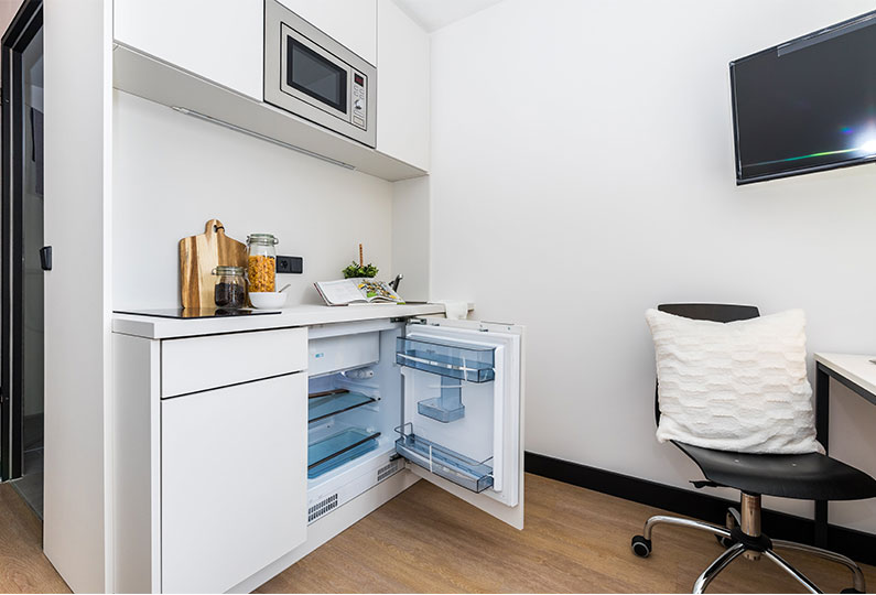 Study room with TV and refrigerator