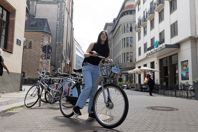 Student riding a city bike