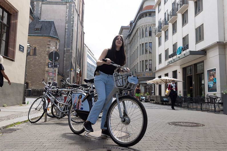 Student riding a city bike