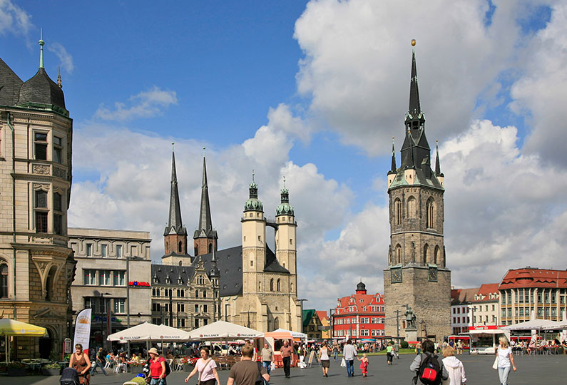 People walking on the road in Halle market