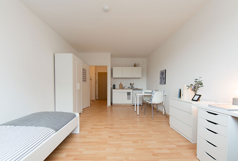 Bedroom with study table and cupboard