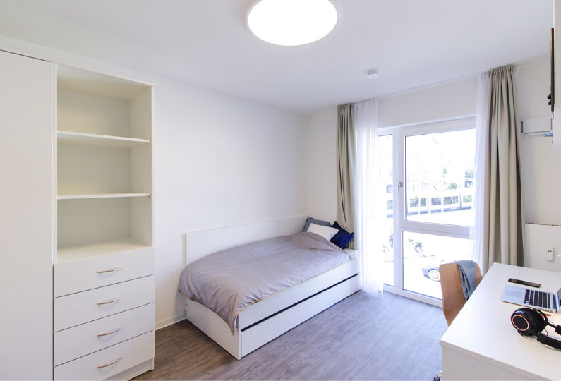 Bedroom with study table and wardrobe