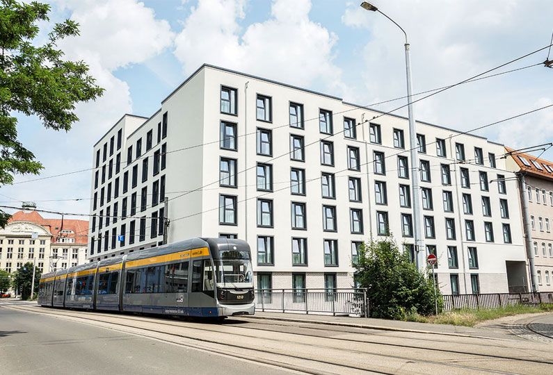 The Hood apartment building near railway track