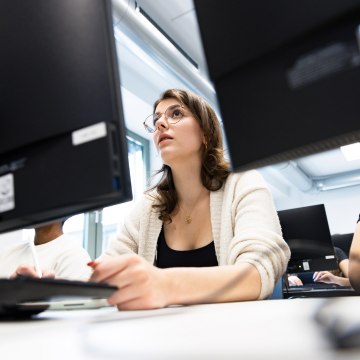 Lancaster Leipzig Cyber Security masters student sat at her computer