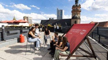 A group of students on the rooftop terrace at Lancaster University Leipzig Campus