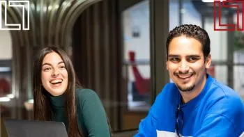 Male and female students smiling
