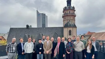 Group of researchers standing together outdoors on a terrace